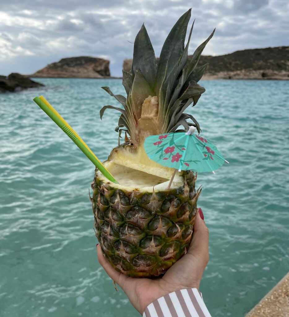 Famous drink served in a pineapple in Comino Island